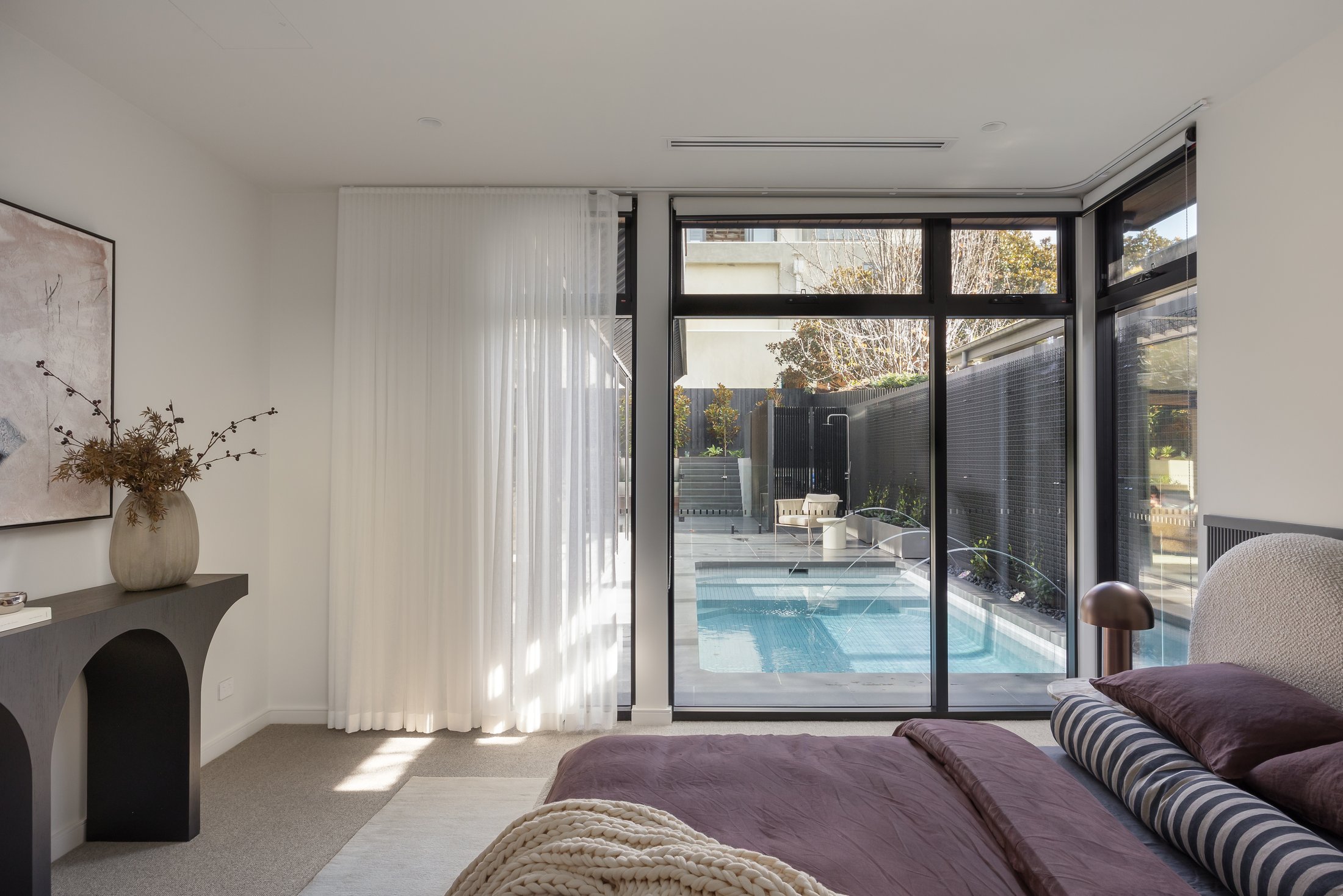 Varcon display home bedroom with pool view, Mont Albert North, master suite overlooking outdoor pool