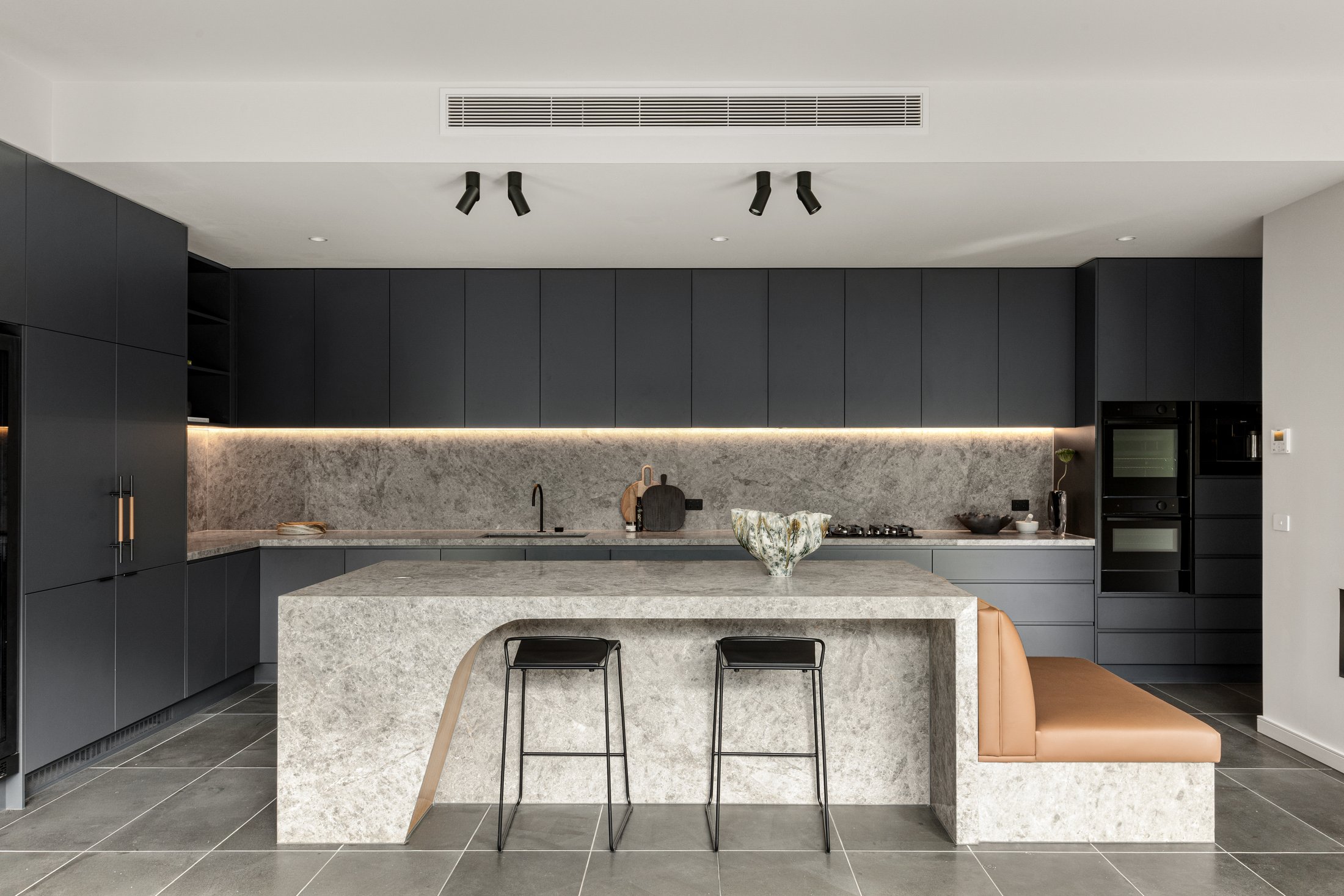 Varcon display home kitchen, Mont Albert North, stone island and integrated banquette seating