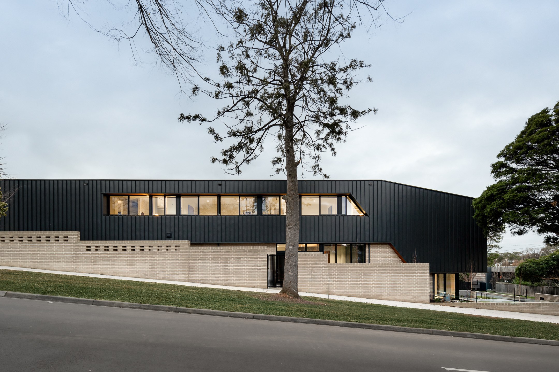 Varcon Group custom home facade, sloping block architecture